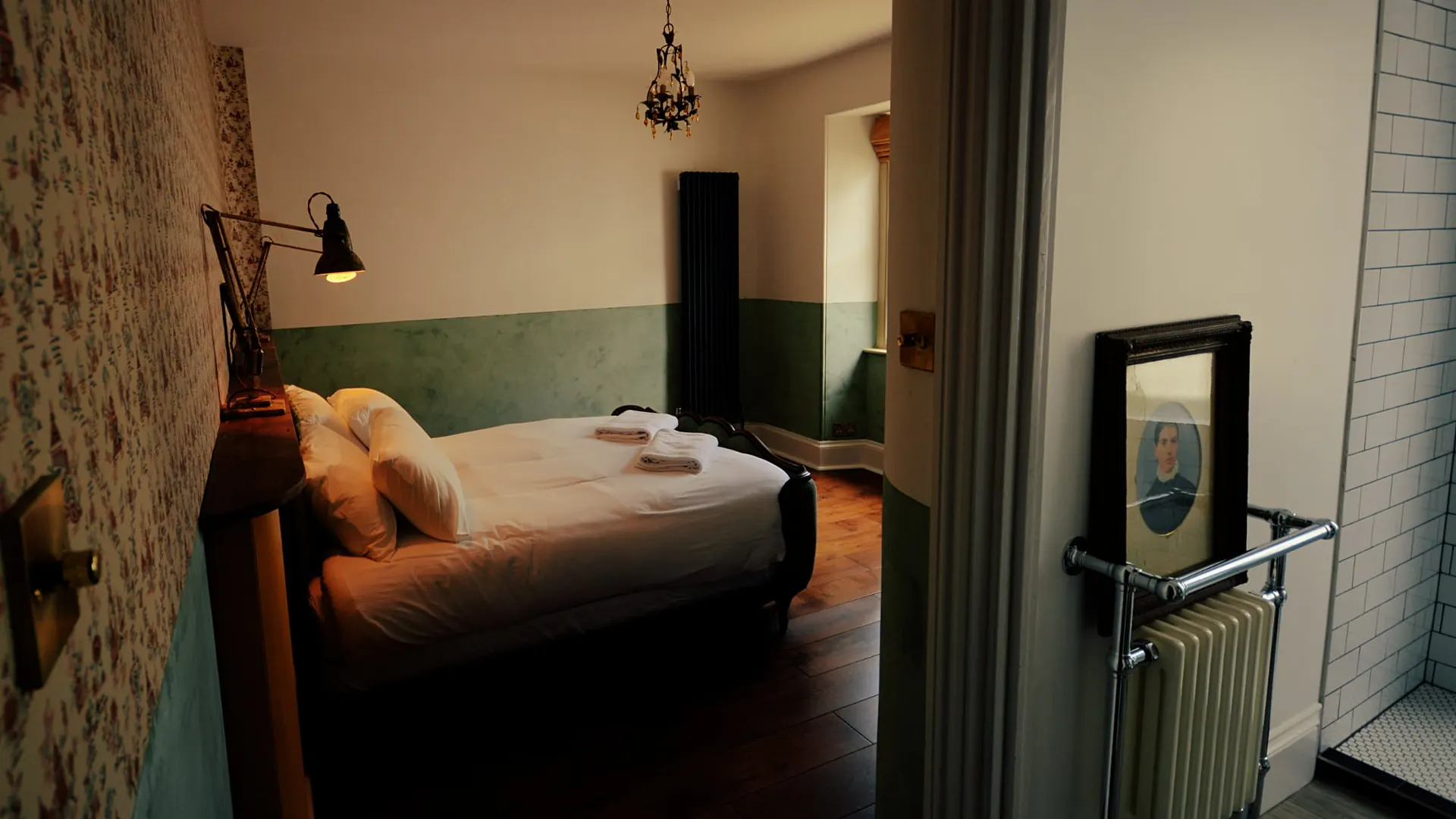The Art Deco room, with green panelling and a period radiator