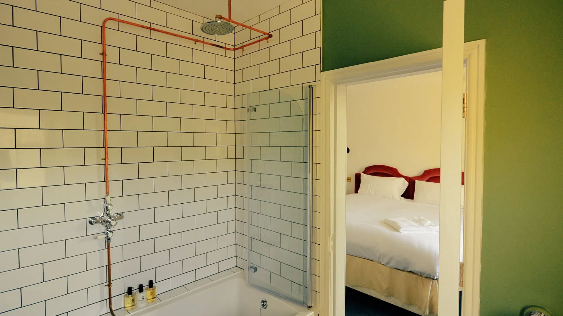 The white-tiled bathroom of the Clean and Bright room