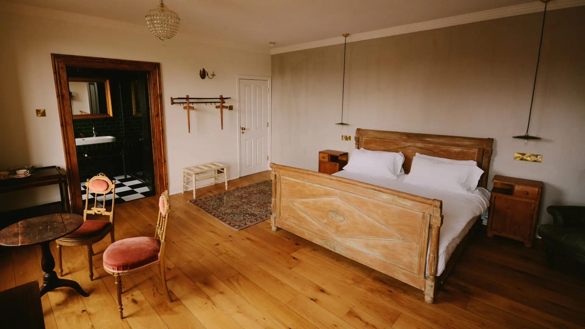 The wooden bed and pendant lights in the Honeymoon Suite